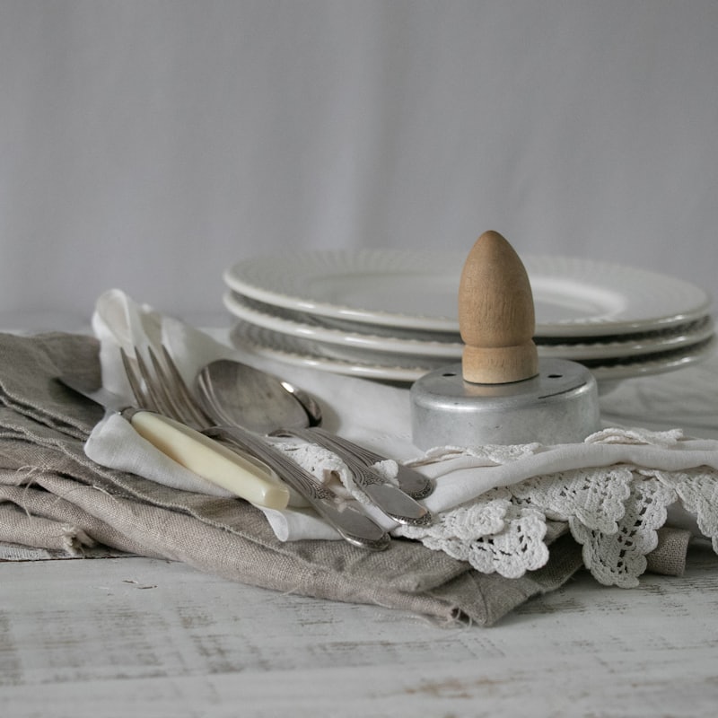 Stacked vintage plates on linen